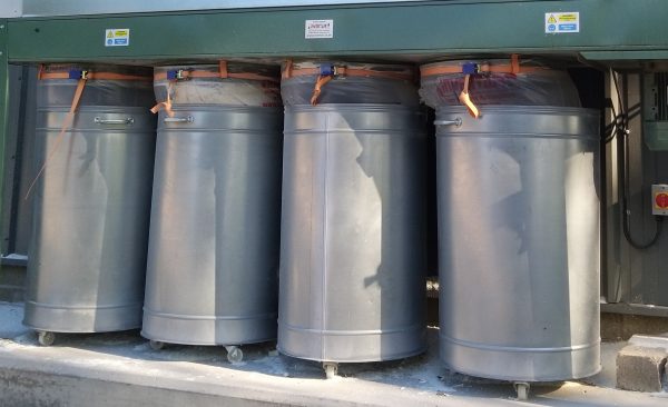 metal bins on castors for protection of wood collection bags